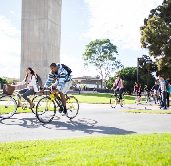 UCSB students riding bikes on campus